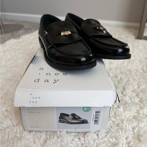 a new day Black Leather Penny Loafers with Gold Trim